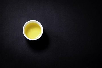 Obraz na płótnie Canvas A cup full of green tea