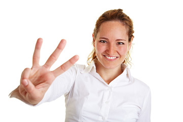 Geschäftsfrau zeigt drei Finger