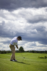 Golf player pitching