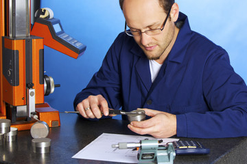 Engineer measuring with caliper