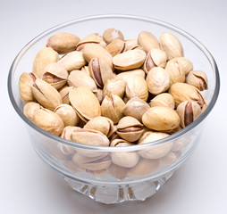 Pistachio nuts in a glass bowl