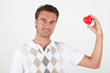 Man holding a heart-shaped object