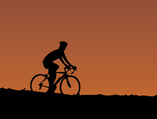 Fototapeta na wymiar cyclist at sunset