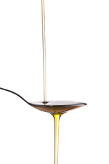 Olive oil jet isolated over a white background