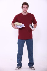 portrait of a man with wallpaper rolls