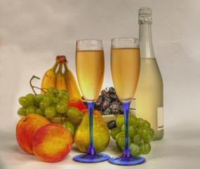 Champagne in glasses and fruits