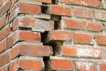 crack of red brick wall