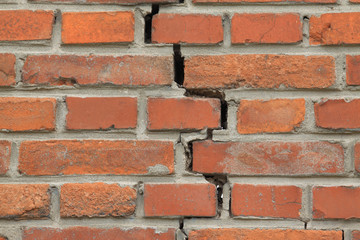 crack of red brick wall