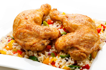 Roasted chicken legs, rice and vegetables