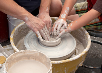 Clay Potters Hands Working Together