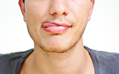 guy shows tongue