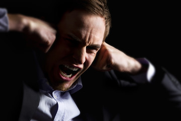 Fototapeta premium Desperate business executive screaming loudly.