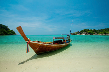 Fototapeta na wymiar One boat on the sea in Southern of Thailand