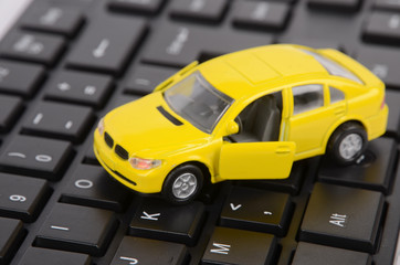 Computer keyboard and toy car