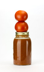 Tomatoes and tomato sauce on white