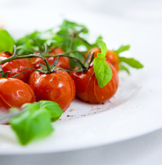Roasted cherry tomatoes on the vine