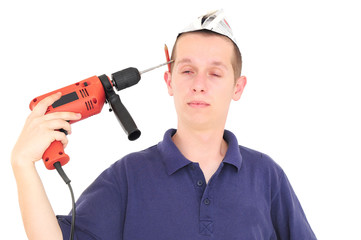 Young worker putting the drill into his head