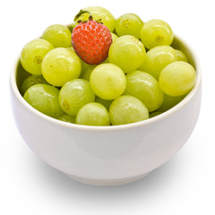 Grape and strawberry in a white cup