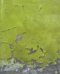 green blathering chipping paint on grunge concrete wall