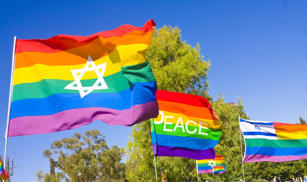 Rainbow flags with national symbols and the word PEACE.