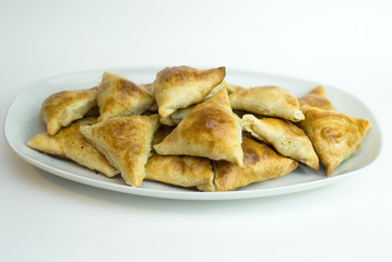 Midle Asian pies with meat, samsa on white background
