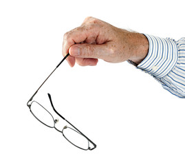 Glasses aka spectacles in hand - studio isolated over white