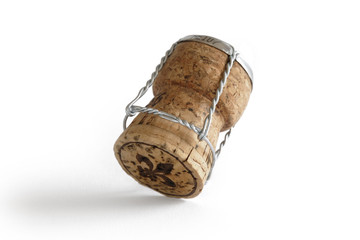 Sparkling wine cork on white background