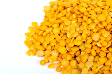 Yellow lentils isolated on white background.Macro shot.