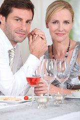 man and woman enjoying a good meal