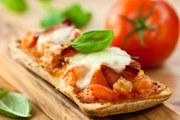 Crostini with tomato,mozzarella and pancetta