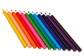 Colorful wooden crayons isolated over white background.