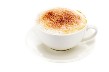 cappuccino in a cup in the shape of hearts isolated on white
