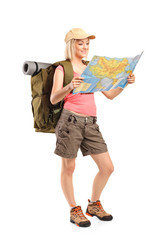 Female hiker looking at map