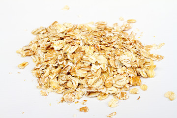Oat flakes on white background