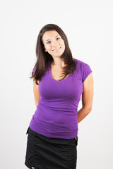 Fototapeta premium Portrait of a beautiful young woman looking happy against.