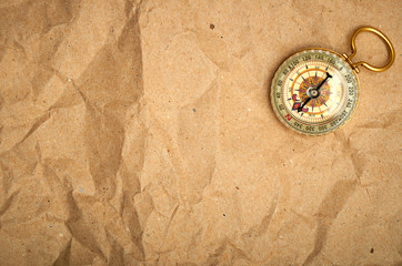 Vintage compass on the paper