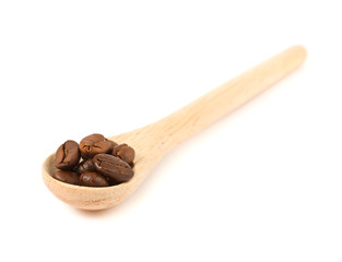 wooden spoon with coffee beans