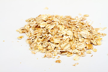 Oat flakes on white background