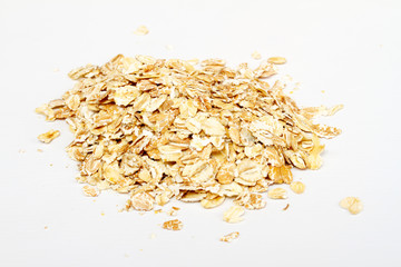 Oat flakes on white background