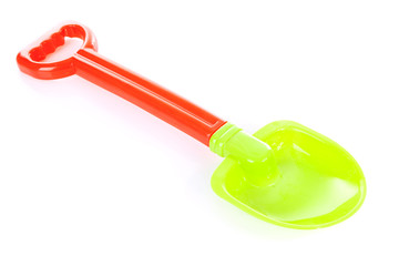 Colorful plastic shovel over white background