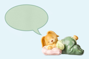 Cute sleeping baby rabbit toy, dreaming of something