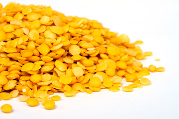 Yellow lentils isolated on white background.Macro shot.