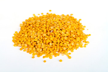 Yellow lentils isolated on white background.Macro shot.