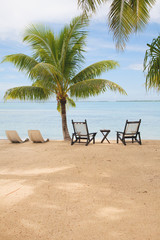 tropical island with empty chairs