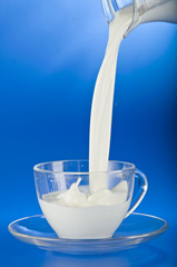 Pouring milk into a cup