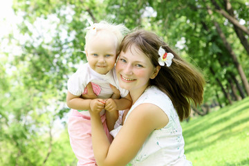 Mother with her daughter outdoors