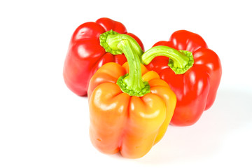 Orange and red pepper isolated on white
