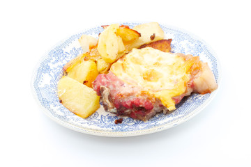Grilled steak meat with cheese sauce and potatoes