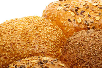 Loaf of bread and rolls isolated on white
