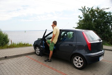 Fototapeta na wymiar Man and his car